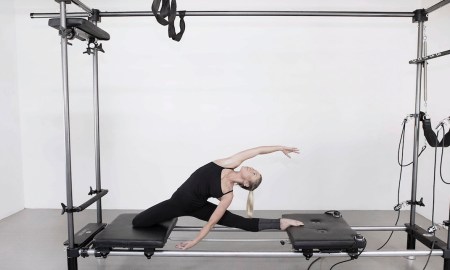 A student at Anna Tetlow Pilates practicing Garuda. Photo courtesy of Tetlow.