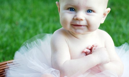 baby in basket with tutu