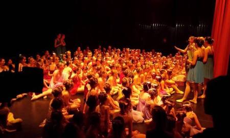 Dancers gearing up for a performance backstage. Photo by Marina Birch