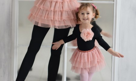 Mum and little girl in ballet clothes.