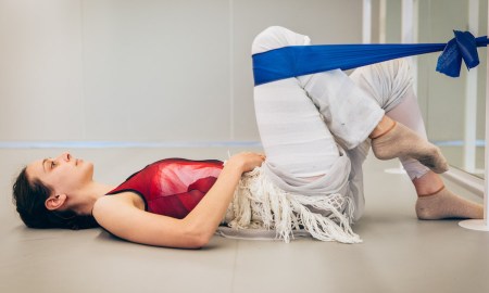 Dimity Azoury of The Australian Ballet demonstrating an exercise for strengthening the iliopsoas muscle that is important for high gesture leg elevation, as well as hip stability when the leg is in arabesque. Photo by Kate Longley.